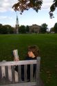 Student reading a book on the campus of Dartmouth College located in the town of Hanover, New Hampshire, USA.