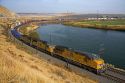 Union Pacific intermodal container train traveling along the Snake River in Elmore County, Idaho, USA.