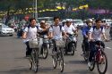 Vietnamese people ride bicycles and motorbikes in Ho Chi Minh City, Vietnam.