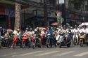 Vietnamese people ride motorbikes in Ho Chi Minh City, Vietnam.