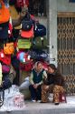 Vendors selling bags and luggage on the street in Hanoi, Vietnam.