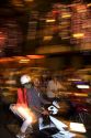 Vietnamese people ride motorbikes on Dong Khoi street during the last night of Tet Lunar New Year celebrations in Ho Chi Minh City, Vietnam.