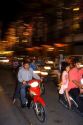 Vietnamese people ride motorbikes on Dong Khoi street during the last night of Tet Lunar New Year celebrations in Ho Chi Minh City, Vietnam.