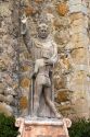 Statue in front of the Great Stone Church at Mission San Juan Capistrano, California, USA.