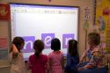 Kindergarten students use an interactive whiteboard in the classroom of a public school in Boise, Idaho, USA. MR