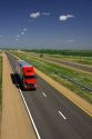 Long haul truck traveling on Interstate 70 in Russell County, Kansas, USA.