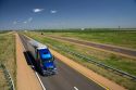 Long haul truck traveling on Interstate 70 in Russell County, Kansas, USA.