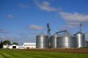 Metal grain storage bins on a farm in Sauk County, Wisconsin, USA.