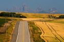 Teton Range in the distance along Idaho Highway 32 near Ashton, Idaho, USA.