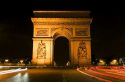 Arc de Triomphe lit at night stands in the centre of the Place Charles de Gaulle, Paris, France.