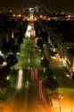 Night view of the Avenue des Champs-Elysees looking toward the Arche de la Defense located in Paris, France.