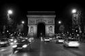 Arc de Triomphe lit at night stands in the centre of the Place Charles de Gaulle, Paris, France.