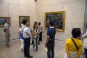 Visitors view artwork displayed in the Musee d'Orsay, Paris, France.