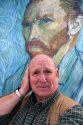 David R. Frazier stands in front of a Van Gogh self portrait outside of the Musee d'Orsay in Paris, France. MR