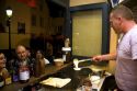 French man making crepes at a Creperie in the Montmartre District of Paris, France.