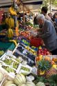 People shopping for produce at an outdoor Saturday market in Paris, France.