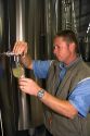 Winemaker testing the fermentation process of Champagne at the M. Hostomme winery in Chouilly, northeast France.