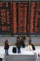 Departure board located in the Paris-Charles de Gaulle Airport, Paris, France.