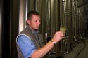 Winemaker testing the fermentation process of Champagne at the M. Hostomme winery in Chouilly, northeast France.