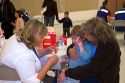 Health care professional administering an injection of the H1N1 influenza vaccine to a child in Boise, Idaho.