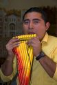 Musician playing a traditional panpipe in the city of Puebla, Puebla, Mexico.