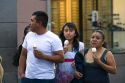 People eating ice cream cones on the street in Mexico City, Mexico.