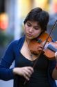 Street performer playing the violin in Mexico City, Mexico.