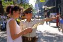 Chilean police officer giving a woman directions in Santiago, Chile.