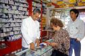 Pharmacist with customer at a drug store in Santiago, Chile.