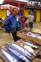Chilean man selling fish at Concon, Valparaiso, Chile.