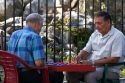 Costa Rican men playing a game of checkers on the street in Limon, Costa Rica.