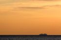 Cruise ship in the pacific ocean at sunset off the coast of Jaco, Costa Rica.