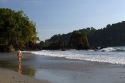 Woman walking on the beach at Manuel Antonio National Park in Puntarenas province, Costa Rica.
