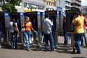 People using pay telephones in the city of San Jose, Costa Rica.