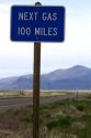 Next gas 100 miles road sign at the Oregon/Nevada border in McDermitt, USA.