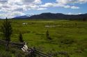 Split rail fencing runs through a meadow near Stanley, Idaho, USA.