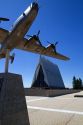 Bronze sculpure of vintage WW11 aircraft in front of the Cadet Chapel at the Air Force Academy in Colorado Springs, Colorado, USA.