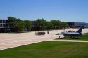 F-16 aircraft on display in the Terrazzo with dormitories in the background at the Air Force Academy in Colorado Springs, Colorado, USA.