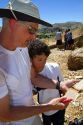 Father and son searching for fossils behind Wheeler High School at the only public fossil field in the united states located at Fossil, Oregon, USA. MR