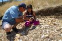 Father and daughter searching for fossils behind Wheeler High School at the only public fossil field in the united states located at Fossil, Oregon, USA.