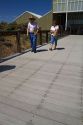 People walk on recycled plastic decking material at the National Historic Oregon Trail Interpretive Center near Baker City, Oregon, USA.