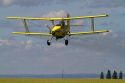 Crop duster spraying pesticide on a corn crop near Jerome, Idaho, USA.