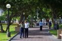 People walk in a park in the Miraflores district of Lima, Peru.