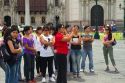 Teacher and students at the Plaza Mayor or Plaza de Armas of Lima, Peru.