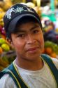 Vendor at a cooperative produce market in the Chorrillos district of Lima, Peru.