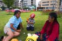 A family sits on the grass at the Love Park in the Miraflores district of Lima, Peru.