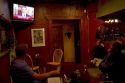 People watch President Obama on the television announcing the death of Osama Bin Laden at a restaurant in Boise, Idaho, USA.