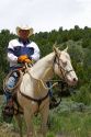 Portrait of a cowboy on a white horse in Cassia County, Idaho, USA.