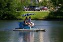 People pedal a paddle boat in Julia Davis Park, Boise, Idaho, USA.