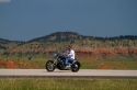 Motorcycle traveling on I-90 in northeast Wyoming near the South Dakota border, USA.